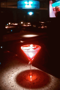 Spot lit red martini glasses