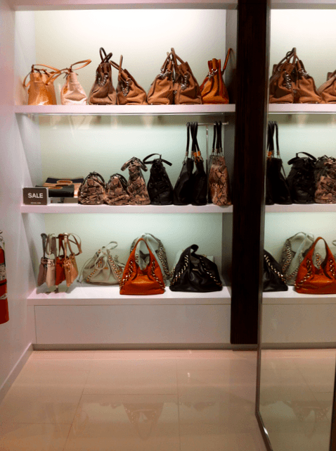 Kors sale merchandise behind a wall. Kors sale merchandise behind a wall.