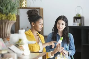 two women engaging in retail store