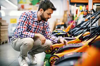 Male shopper checking out products