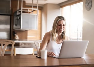 woman working remotely on laptop