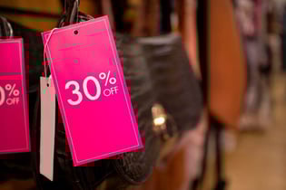 pink sale tag on purse
