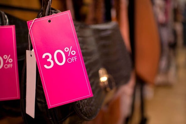 pink sale tag on purse