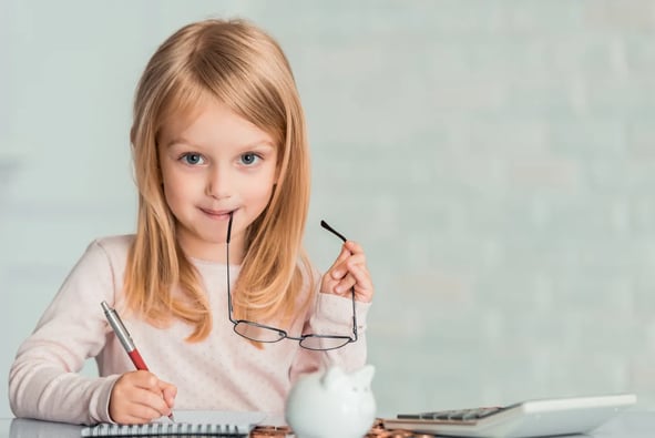 Little girl balancing books
