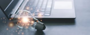 Light bulb and laptop for online training