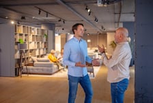 two guys in furniture store