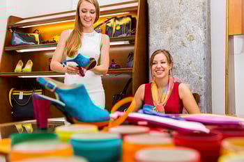 woman buying colorful shoes in store