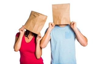 Two people with bags covering their heads
