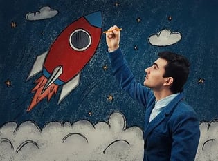 Man drawing a rocket 