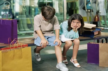 Frustrated children in store