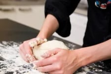 Hands kneading dough