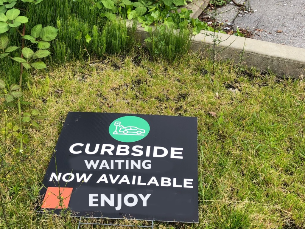 store appearance curbside waiting sign