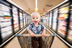 boy in shopping cart