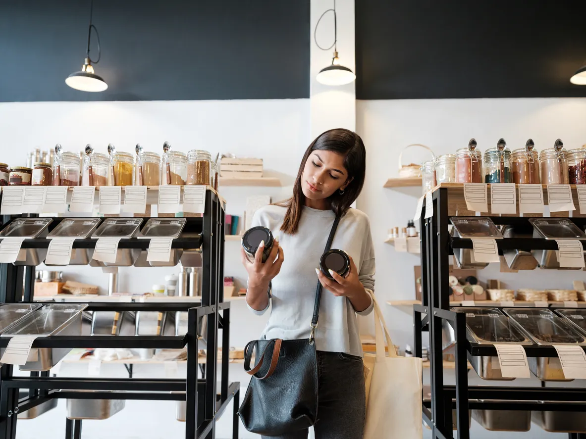 woman in store comparing two products
