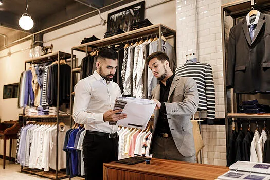 Salesman and customer in retail store